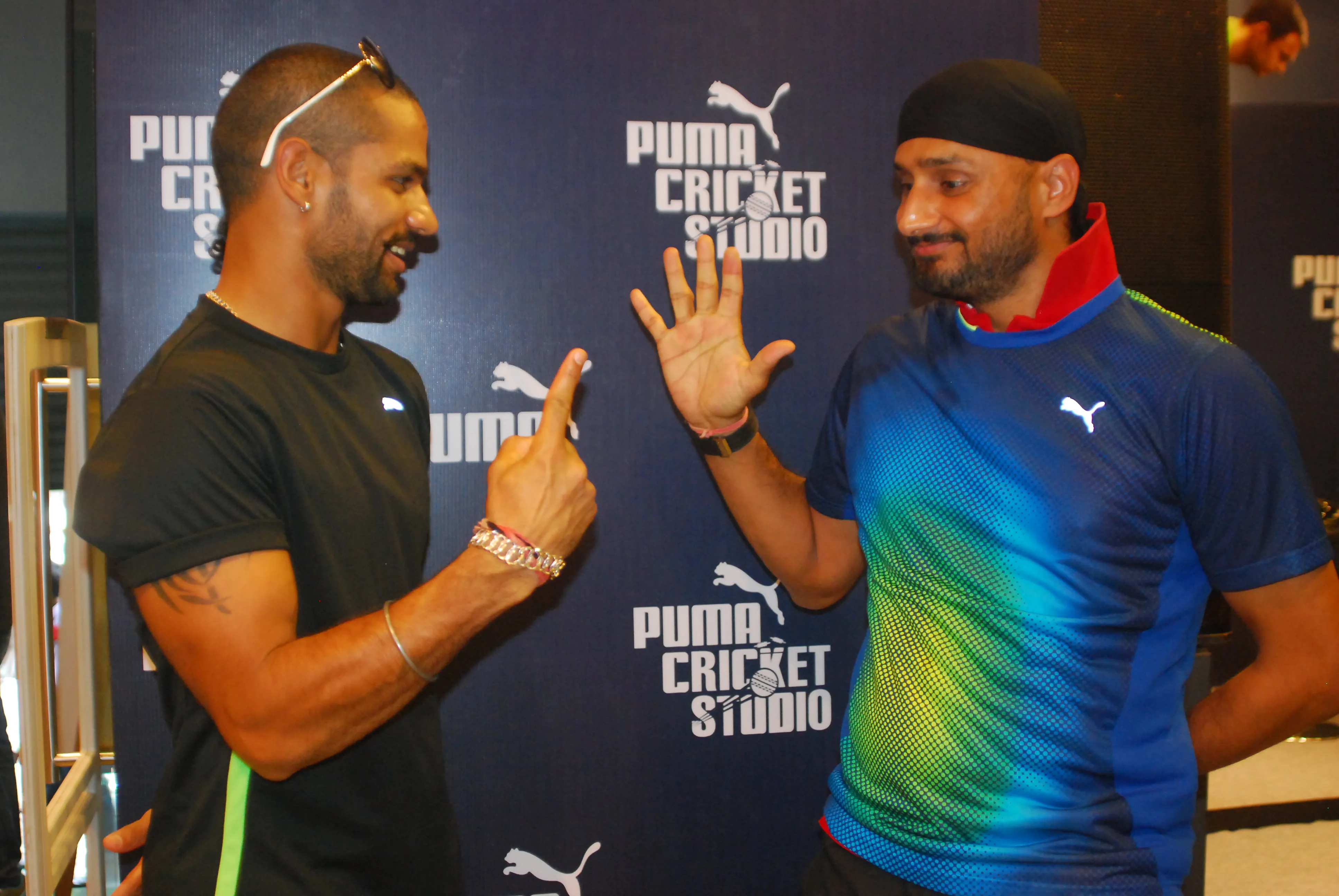 Dhwan and Bhajji battling it with Finger Bash at the PUMA store